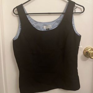 black lined sleeveless top with blue detailing